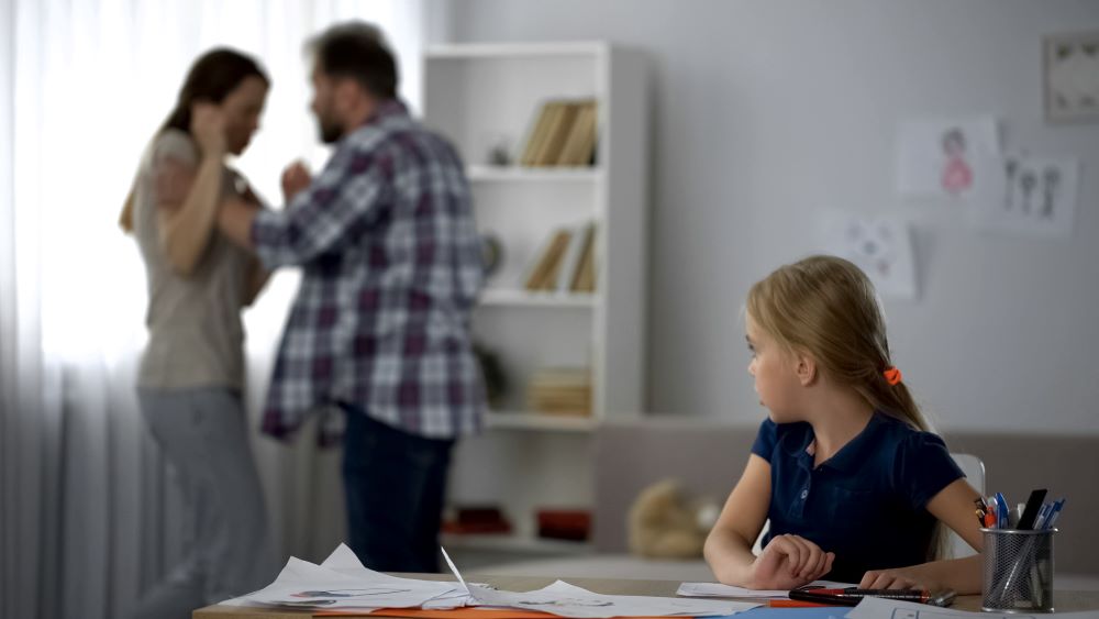 parents fighting, child watching