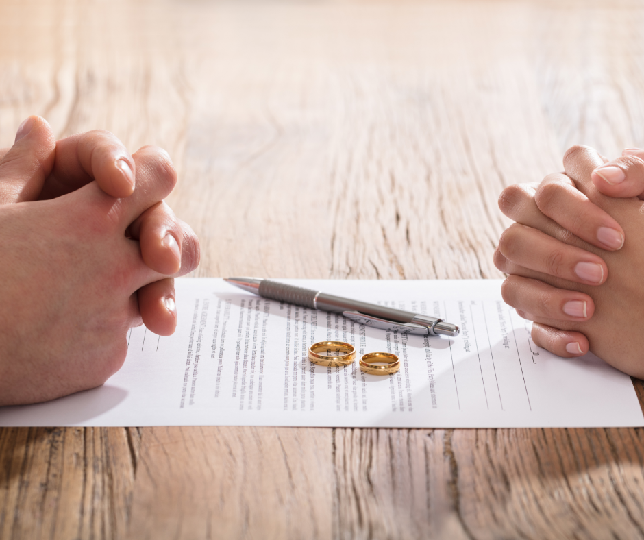divorce paper and rings on table